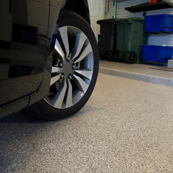 Epoxy-coated carport floor installed by Epoxy Flooring Guys Melbourne. Durable surface built to resist oil stains and daily use.