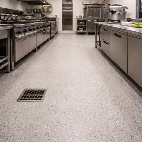 Commercial kitchen epoxy flooring in Melbourne featuring a durable epoxy floor suited to high-traffic cooking and prep areas.